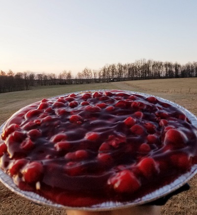 Pie in the Sky--cherry pie held up to the sky