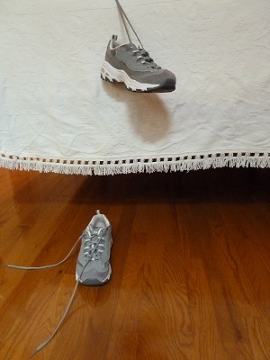 Wait for the Next Shoe to Drop--shoe hanging beside bed