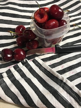 The Pits-overflowing bowl of cherries and knife