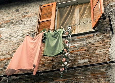 Hang Out to Dry--clothes on a clothesline outside a window