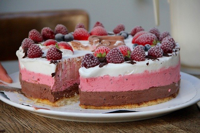 It Don't Make Me No Never Mind-Neapolitan ice cream cake with berries on top 