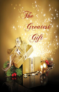 The Greatest Gift book cover-opened gold box with ribbon surrounded by pine, berries, and stars